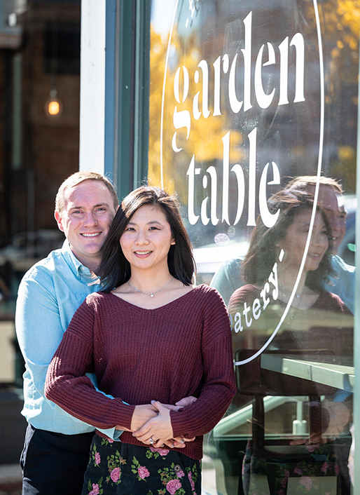 The happy couple revisiting the location of their first date, Garden Table on Mass Ave.